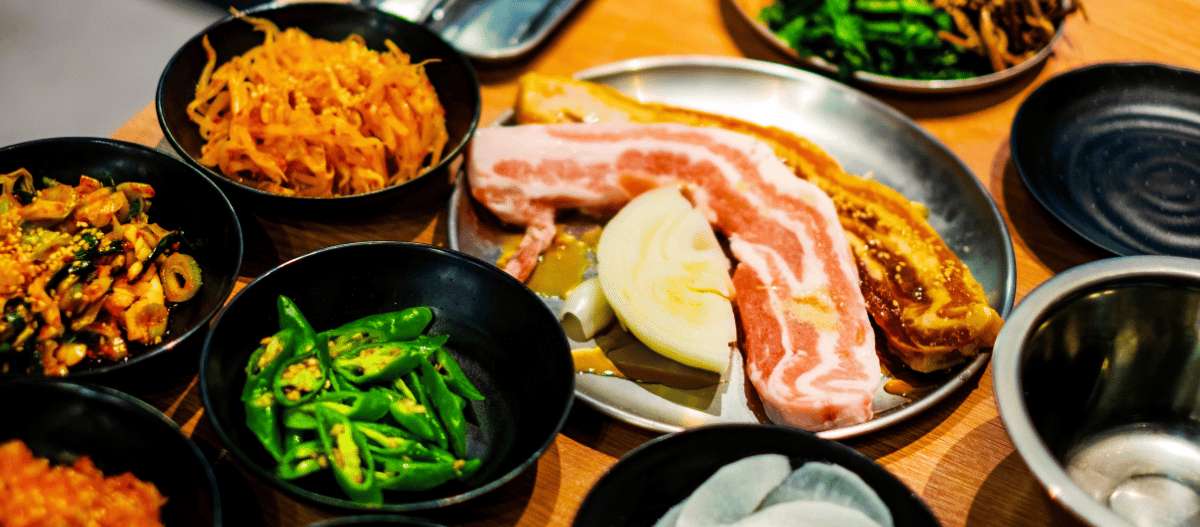 Korean samgyeopsal: grilled pork belly with assorted banchan