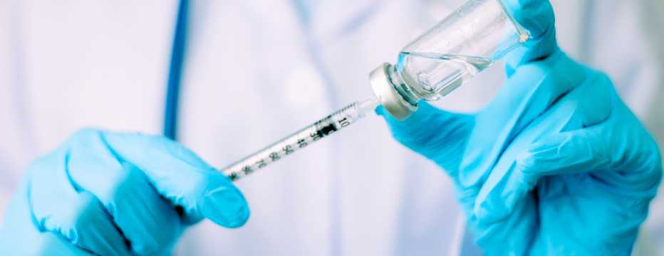 Healthcare professionals preparing a vaccine, a health requirement for travelling to Asia in 2026.