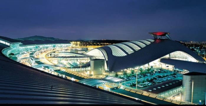 Exterior of Incheon International Airport’s curved glass terminal in South Korea.
