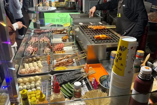 Skewered street food stall at Temple Street Night Market in Hong Kong