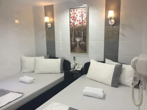 V Inn Kamar Photos