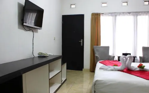 The Rizen Hotel Kamar Photos