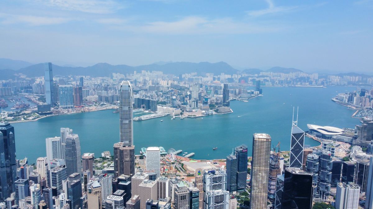 Aerial view over Hong Kong Island and Victoria Harbour taken from Victoria Peak, with the International Finance Centre tower in the foreground and Kowloon across the water