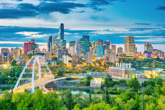 The Edmonton skyline at dusk, seen across the river valley